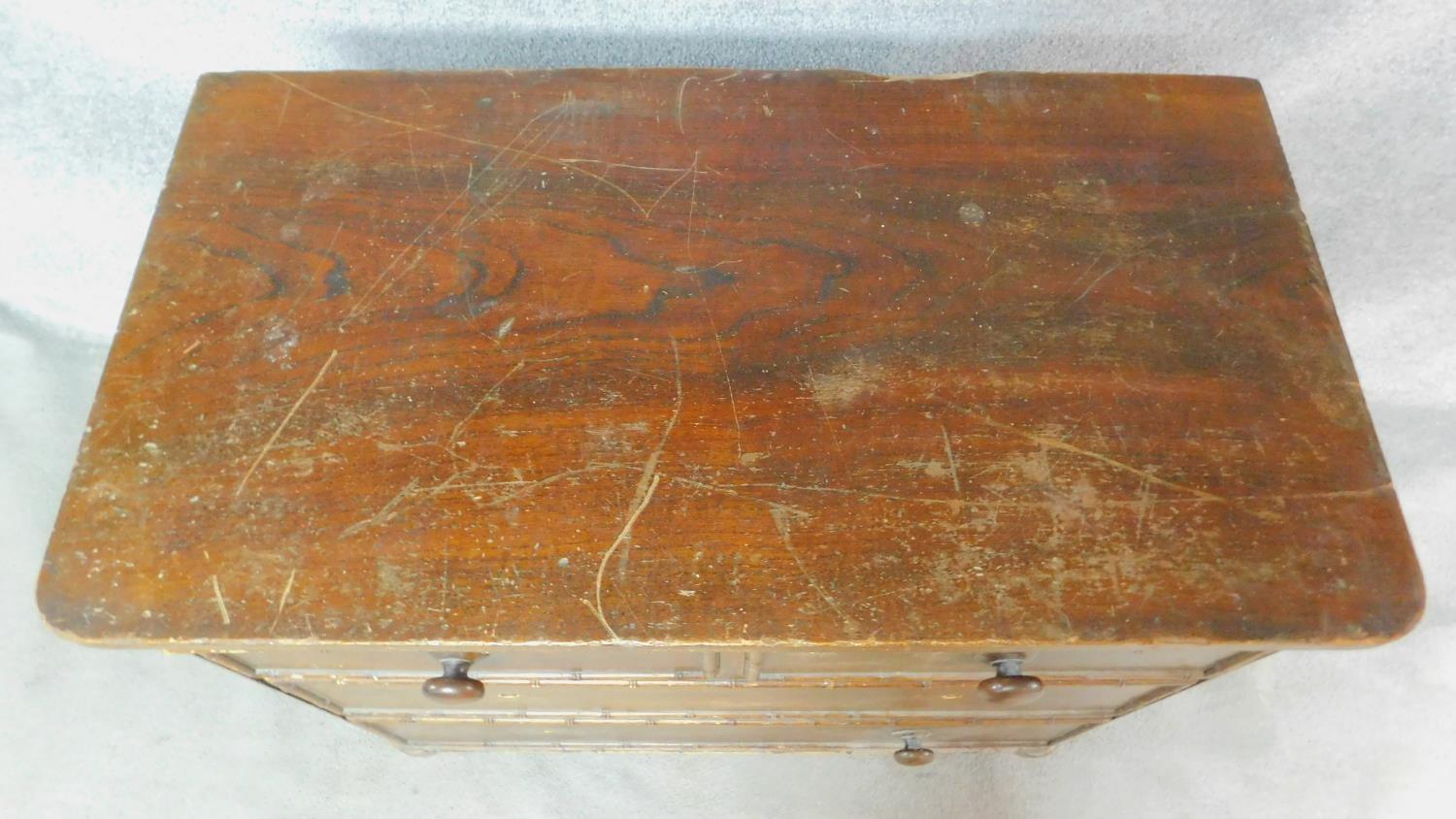 An early 19th century pitch pine chest of drawers with faux bamboo mouldings raised on squat - Image 4 of 6
