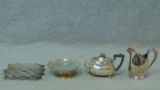 A silver plated teapot along with a silver plated milk jug, small comport and a pierced checker