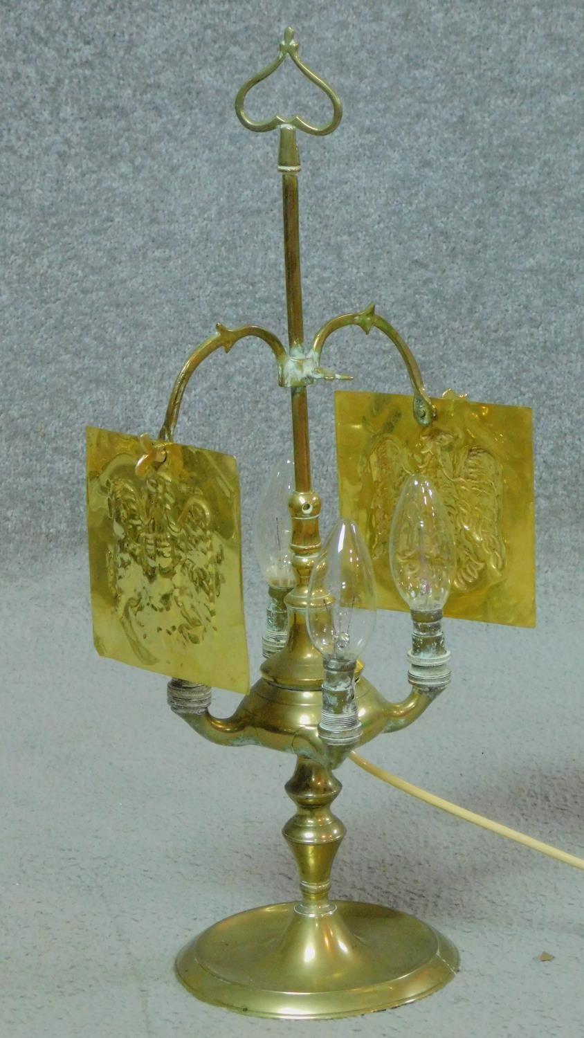 A 19th Century Italian brass lucerna, converted to electric, adjustable, four branch oil lamp. It
