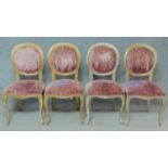 A set of four distressed gilt Louis XV style dining chairs in faded blush upholstery. H.98cm