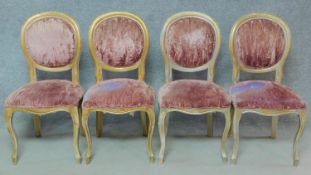 A set of four distressed gilt Louis XV style dining chairs in faded blush upholstery. H.98cm