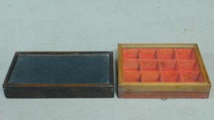 An ebonised table top jewellery display case and a similar fitted case. H.5 W.31 D.17cm