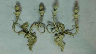 A pair of gilt metal Rococo style twin branch wall candelabras. H.40 W.28cm (previously wired for