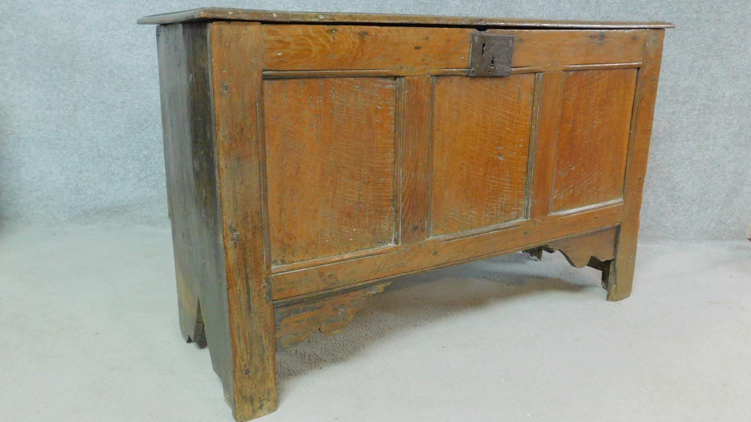 A Georgian country oak coffer with hinged top and panelled sides on block supports. H.73 W.122 D. - Image 2 of 6