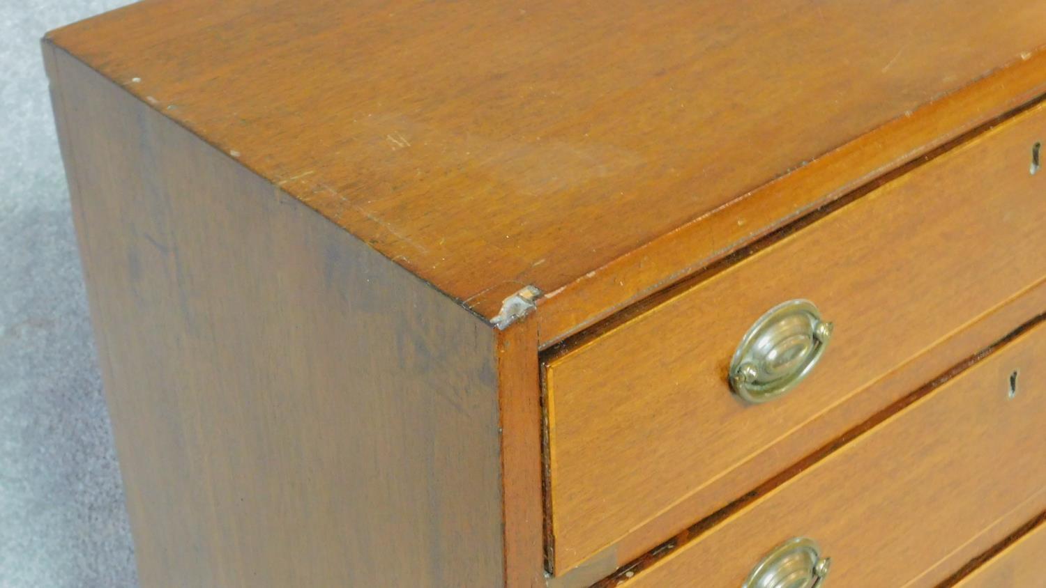 A Georgian mahogany chest of four graduating drawers of compact size on bracket feet. H.81 W.71 D. - Image 7 of 8