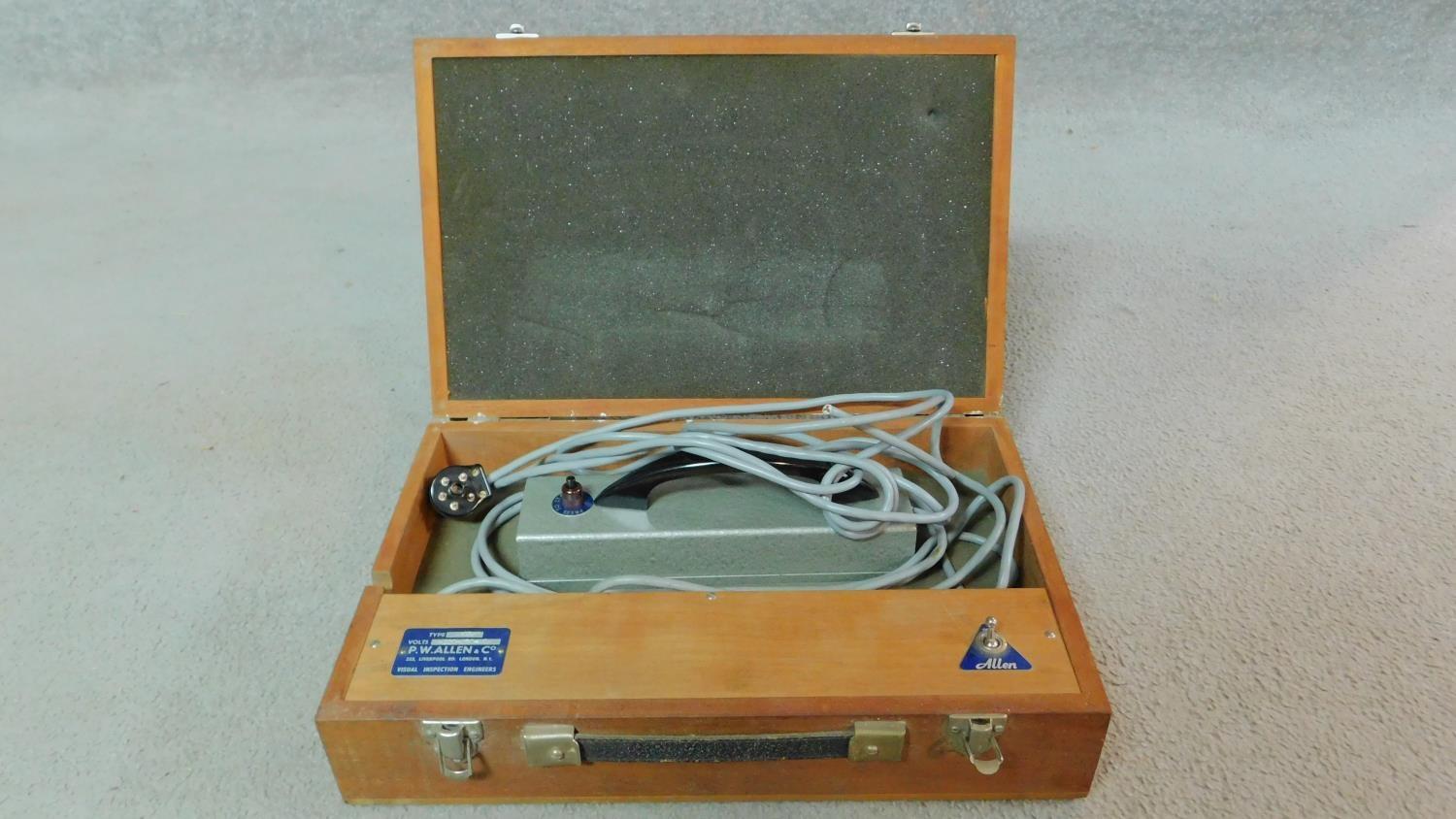 A wooden cased vintage P. W. Allen Ultra Violet inspection lamp. With makers label and handled