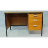 A mid century vintage teak and metal framed desk with a bank of three graduating drawers. H.71 W.107