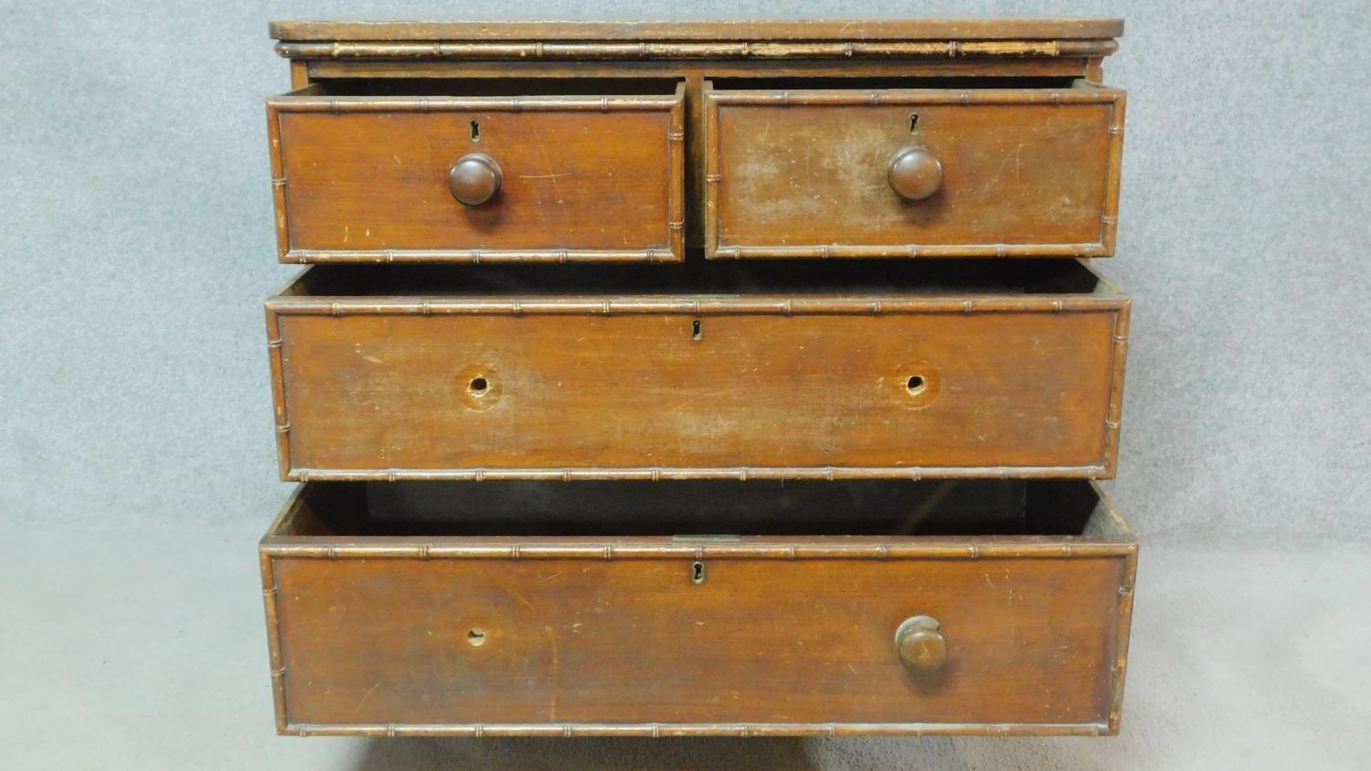 An early 19th century pitch pine chest of drawers with faux bamboo mouldings raised on squat - Image 3 of 6