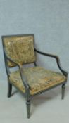 A Regency painted and ebonised open armchair on tapering spiral twist supports. H.80cm