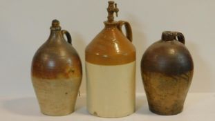 Three antique salt glazed stoneware flagons, two with stoppers. One stamped Joseph Smith 1780, one