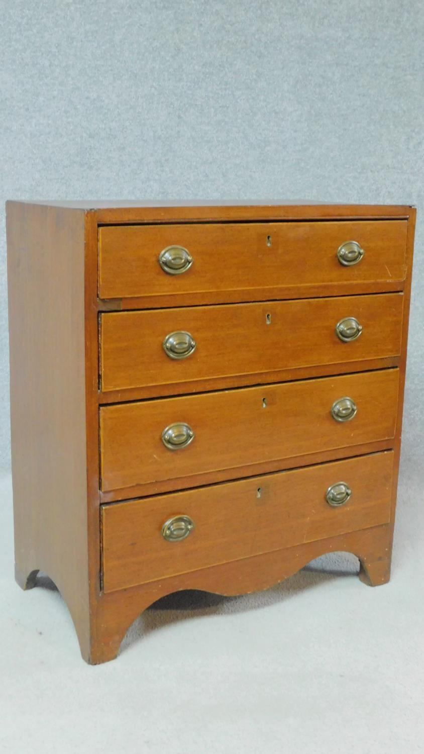 A Georgian mahogany chest of four graduating drawers of compact size on bracket feet. H.81 W.71 D. - Image 2 of 8