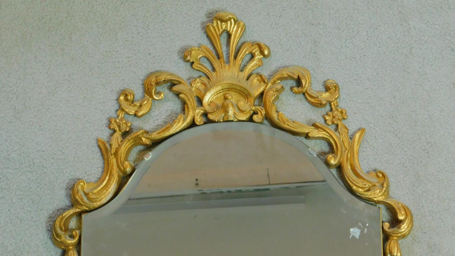 A mid century pier mirror with bevelled glass and gilt Rococo style frame. 47x104cm - Image 2 of 4