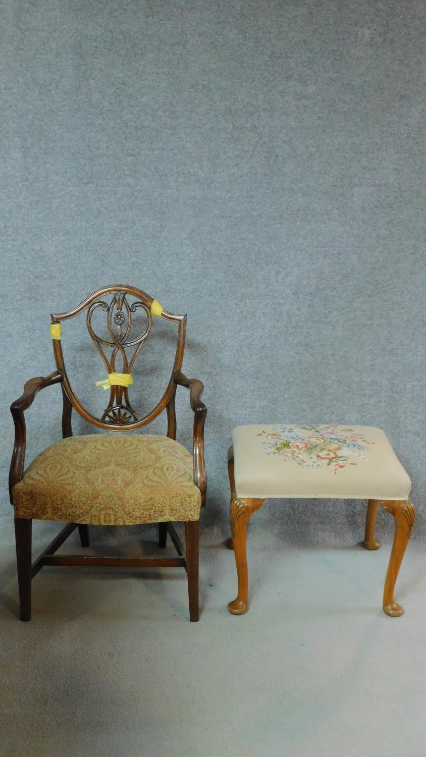 A 19th century mahogany Hepplewhite style armchair and a tapestry upholstered footstool. H.96cm