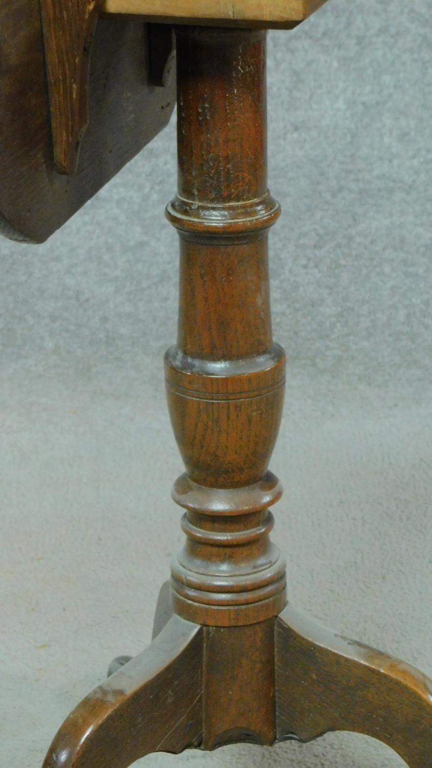 A Georgian oak tilt top occasional table on tripod pedestal base. H.64 W.49 D.45cm - Image 5 of 6