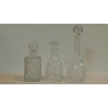 Three antique cut glass decanters with faceted stoppers. H.34cm