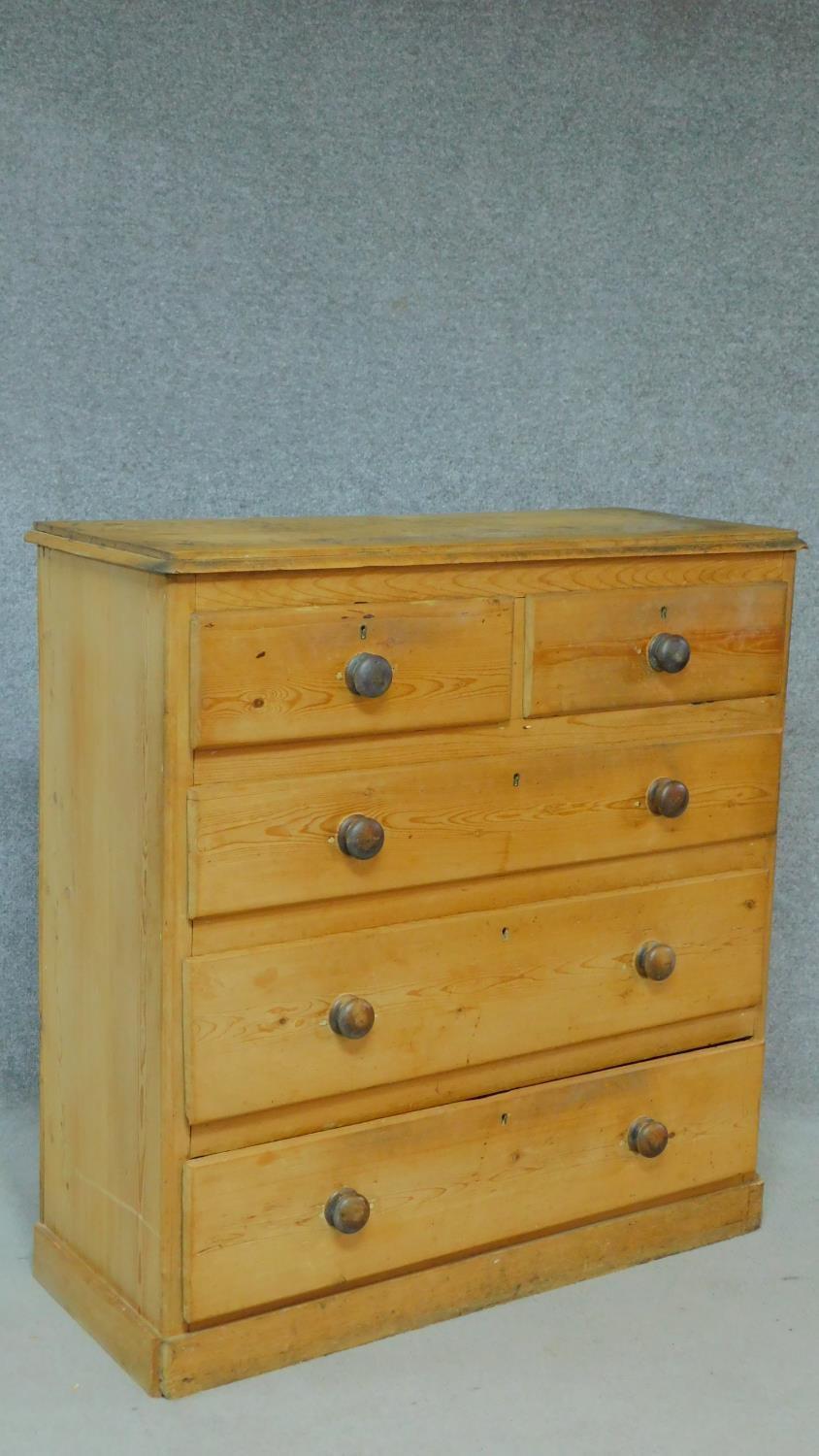 A Victorian pine chest of two short over three long graduated drawers on plinth base, fitted with - Image 2 of 5