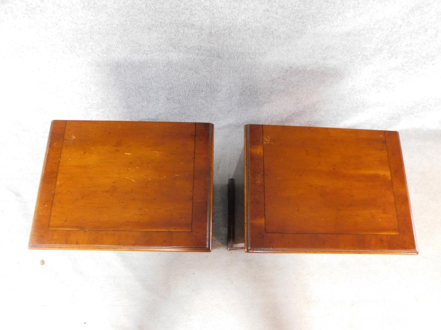 A pair of Georgian style yew wood and crossbanded bedside chests of four drawers on bracket feet. - Image 3 of 4