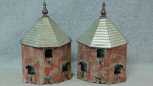 A pair of distressed painted metal wall hanging bird houses. H.49 W.32 D.17cm