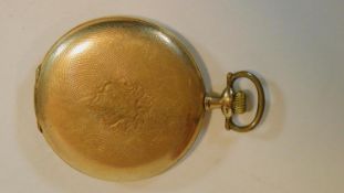 A gold plated pocket watch with engine turned design and shield shape cartouche, maker B. Reinin.