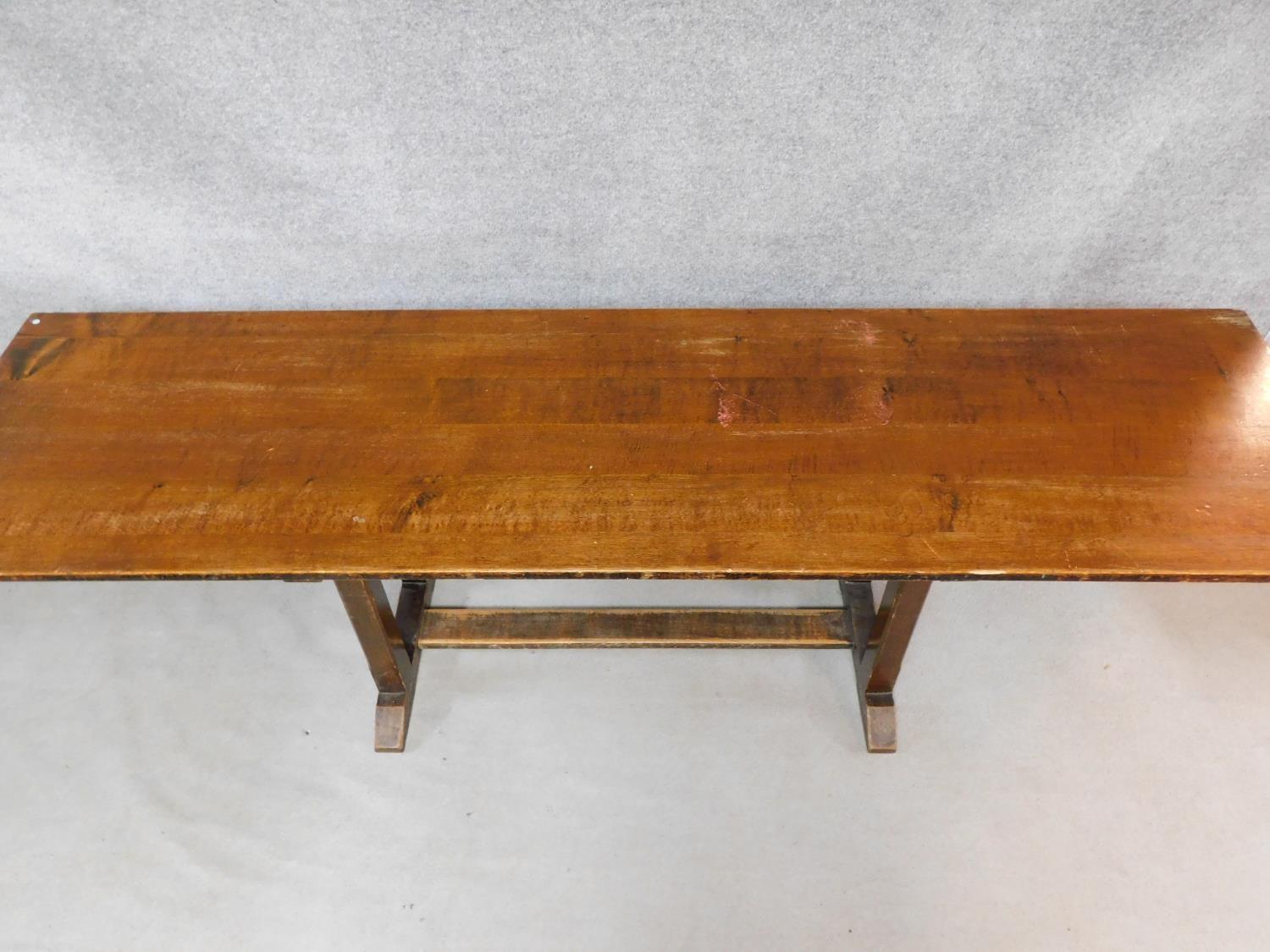 An oak refectory style dining table on stretchered chamfered square section supports on a platform - Image 2 of 4