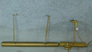 A miscellaneous collection of wall mounted brass picture lights.