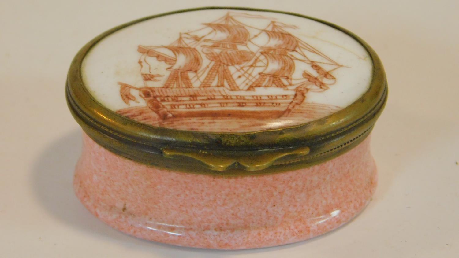 A Georgian enamel patch pot with pink speckled enamel base and hand painted sailing galleon design