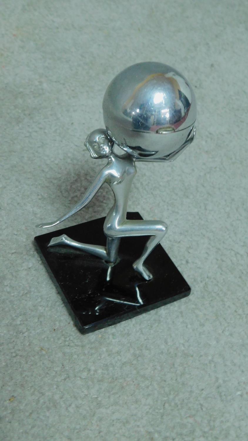 A mid century vintage chromium table lighter in the form of a female rhythmic gymnast and ball. H. - Image 4 of 5