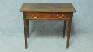 A Georgian country oak side table fitted with frieze drawer on square supports. H.71 W.86 D.46cm