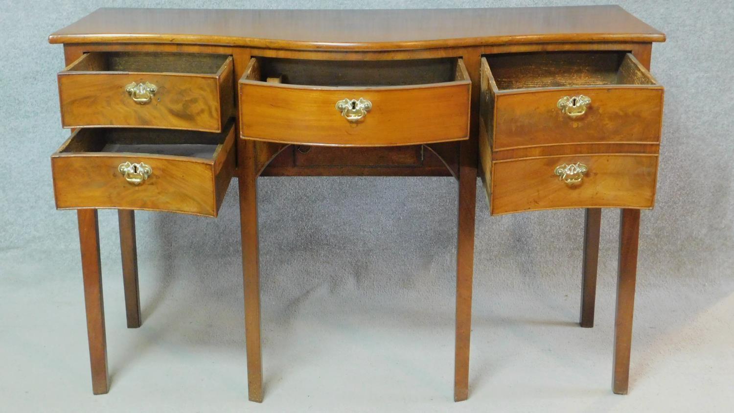 A small Regency mahogany serpentine fronted sideboard with an arrangement of five drawers and fitted - Image 2 of 7