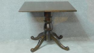 A Victorian style stained pine occasional table on quadruped cabriole supports. H.75 W.90 D.90cm