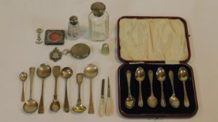 A cased set of English hallmarked teaspoons and a miscellaneous collection of silver and white metal