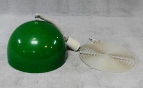 A vintage 1970's rise and fall pendant light shade of domed form in emerald green. H.60cm