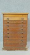 A 19th century pine table top specimen chest of nine fitted graduating drawers. H.72 W.51 D.30cm