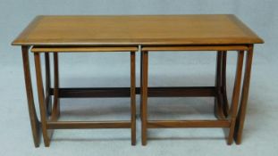 A nest of three vintage teak G-Plan style occasional tables. H.52 W.98 D.48cm