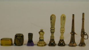 A collection of antique wax seals. Including two bone handled brass seals, one says 'I envy my