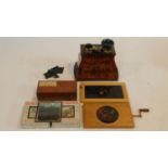 A collection of antique magic lantern slides and antique camera accessories. Including two boxes