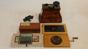 A collection of antique magic lantern slides and antique camera accessories. Including two boxes