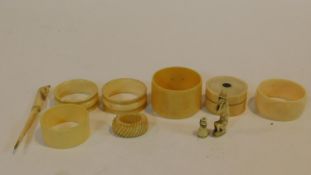 A collection of antique bone and ivory and ivorine items. Including five antique napkin rings (three