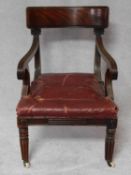 A William IV mahogany bar back armchair with acanthus carving on reeded tapering supports. H.79cm
