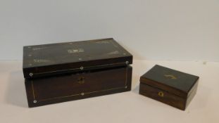 A Regency rosewood writing slope with mother of pearl inlay and brass inset military style handles