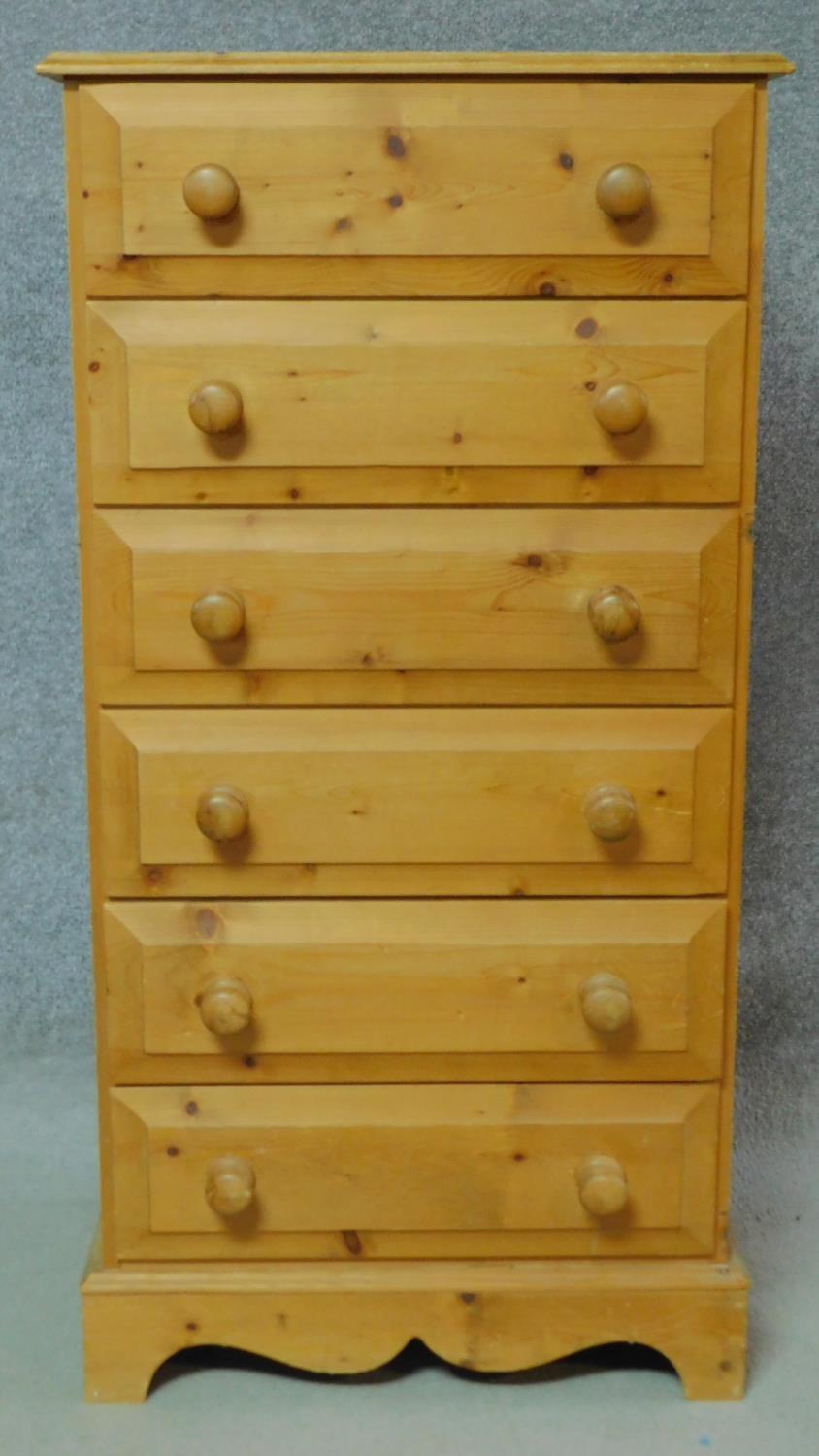 A Victorian style pine tall chest of six drawers on shaped bracket feet. H.123 W.63 D.45cm