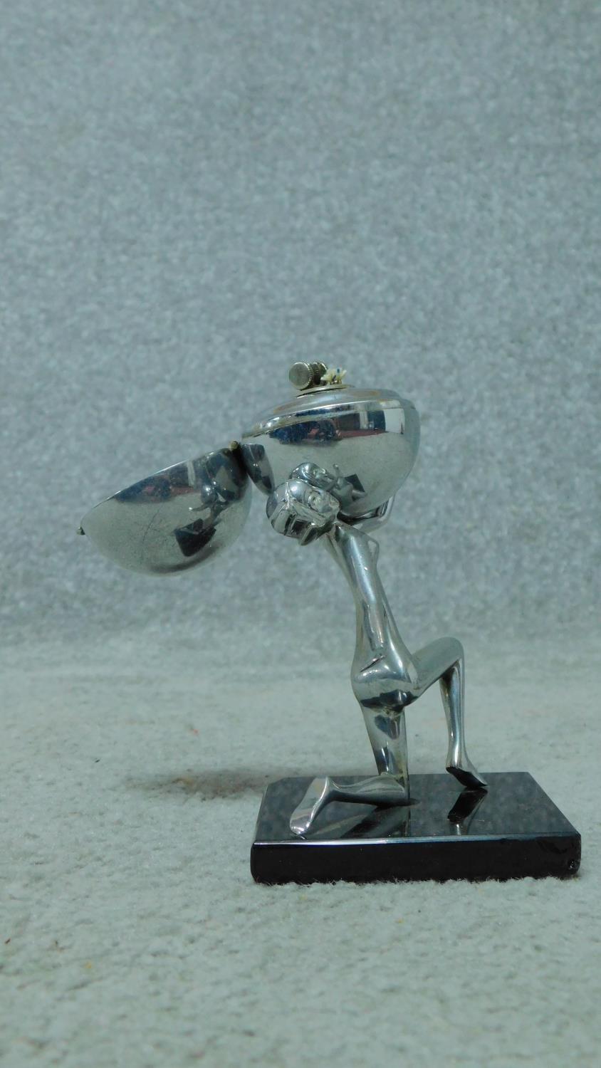 A mid century vintage chromium table lighter in the form of a female rhythmic gymnast and ball. H. - Image 2 of 5