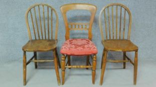 A pair of 19th century stick back Windsor dining chairs with elm seats and a Victorian mahogany