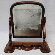 A Victorian mahogany swing frame mirror on platform base with original glass plate. 75x68cm