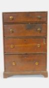 A Georgian oak apprentice piece chest of four drawers on bracket feet. H.46 W.31 D.18cm