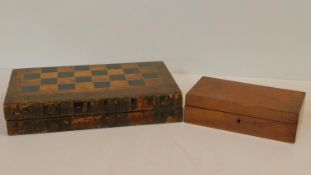 A 19th century cased backgammon and draughts set with faux book spine decoration and a 19th