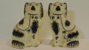 A large pair of late 19th century Staffordshire mantel dogs. H.30cm