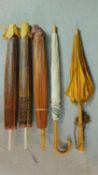 A miscellaneous collection of five parasols to include three decorative Chinese and two other