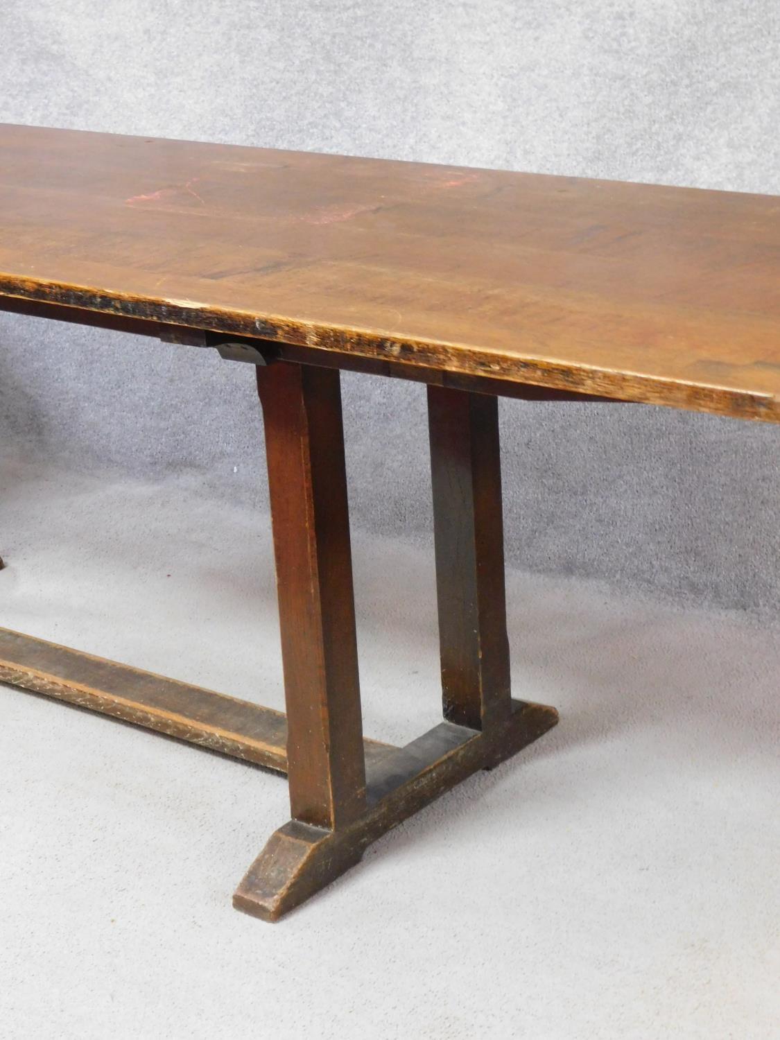 An oak refectory style dining table on stretchered chamfered square section supports on a platform - Image 3 of 4