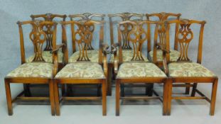 A set of eight 20th century Chippendale style oak dining chairs with pierced splat back and drop